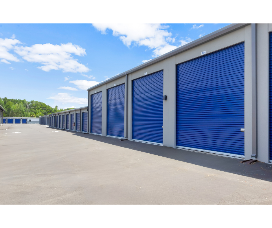 Rows of drive-up self storage units with roll-up doors